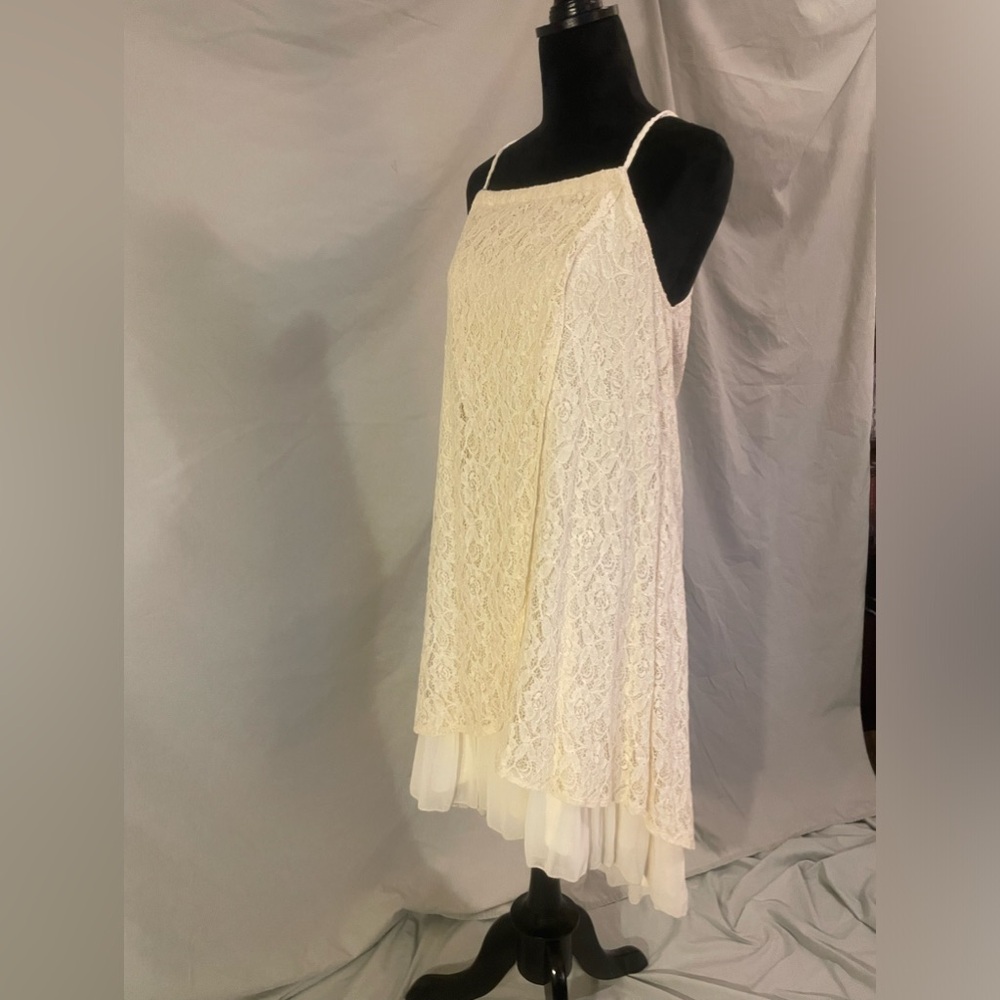 Brand new beach-boutique dress. Size large. Halter style next, lace overlay.